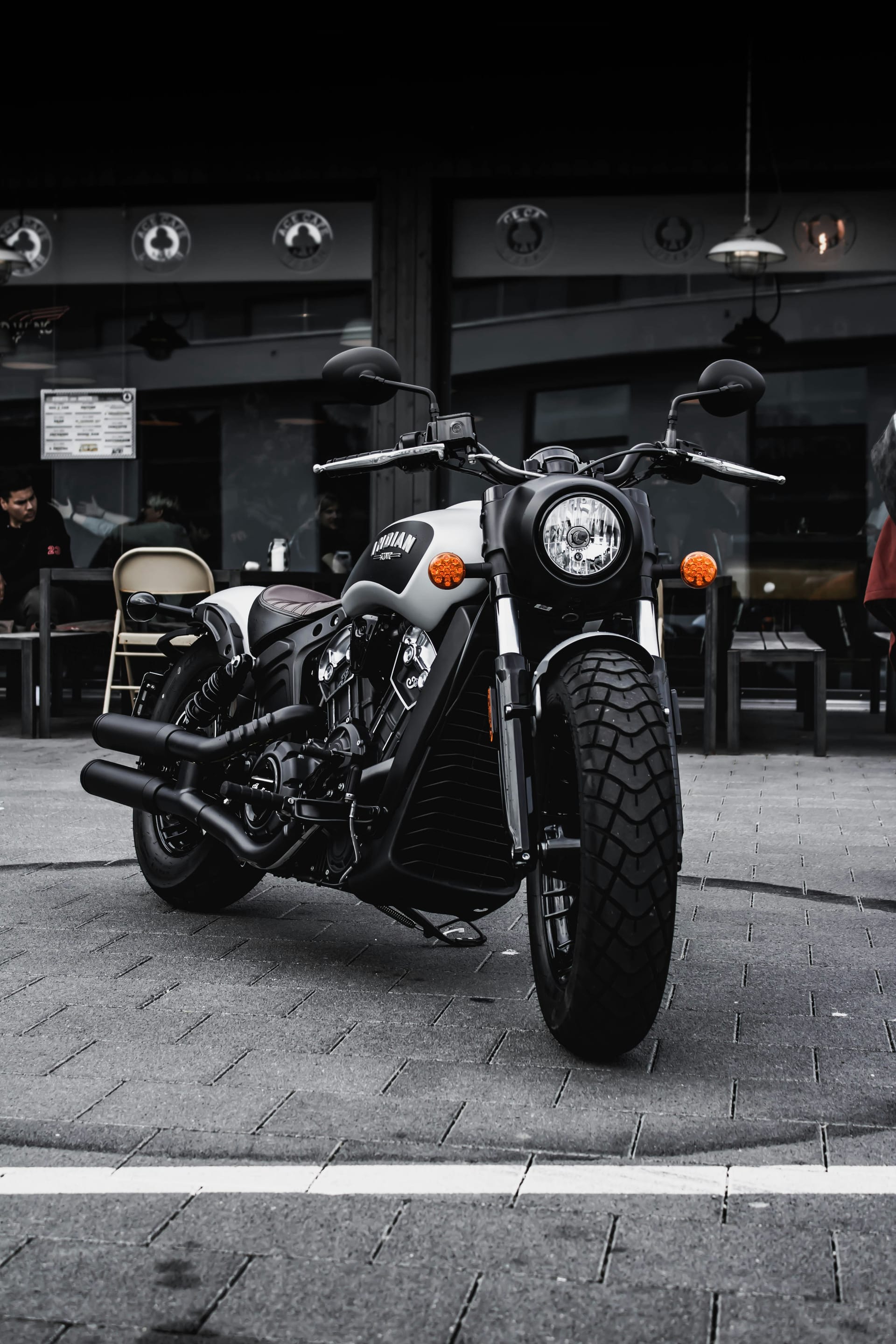 Indian Scout Bobber parked at a cafe
