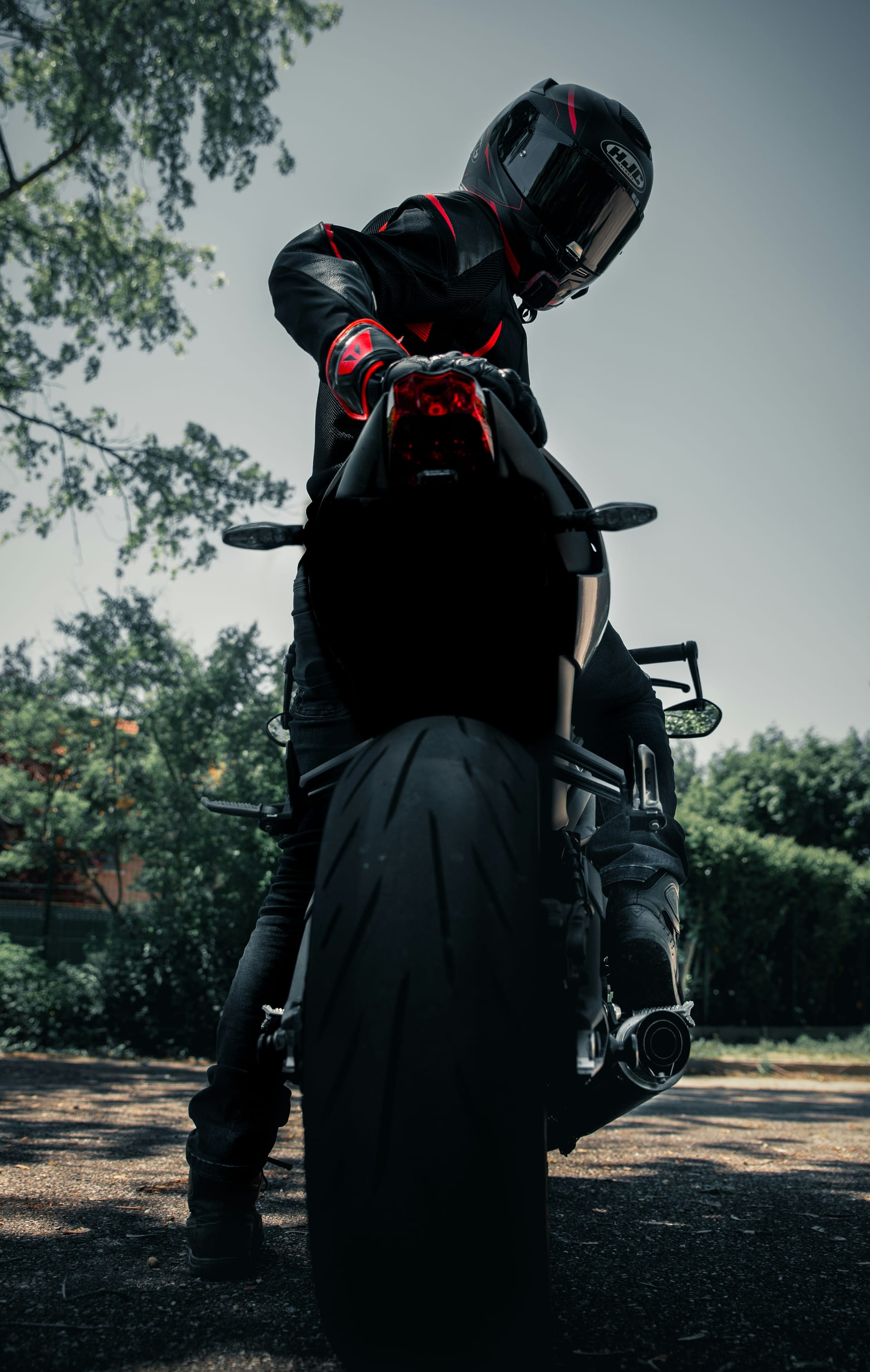 Motorcycle tied down with wheel chocks and soft straps