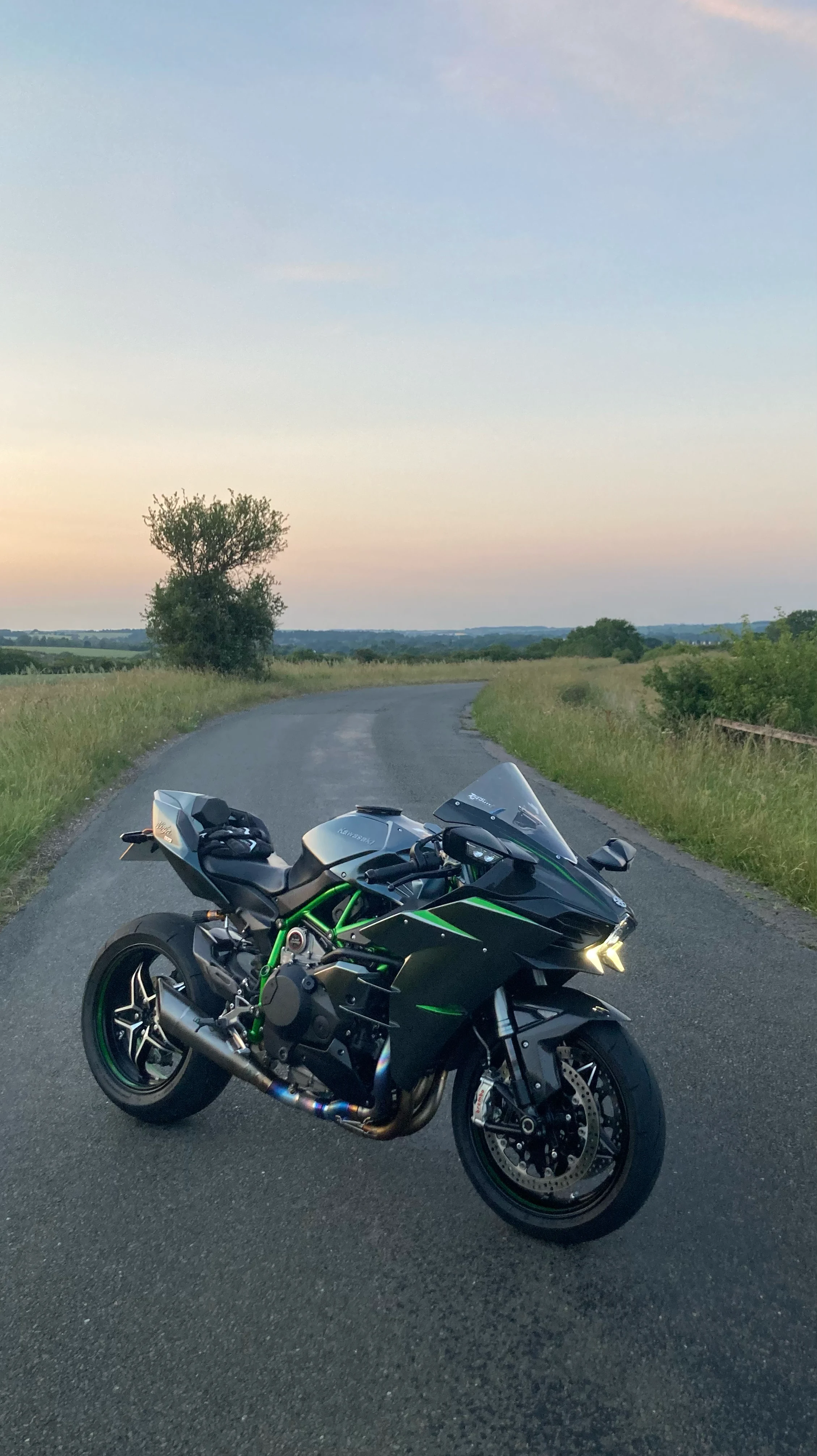 Black Kawasaki H2 on a British country road